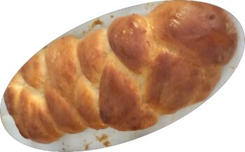 A braided loaf of freshly baked bread.