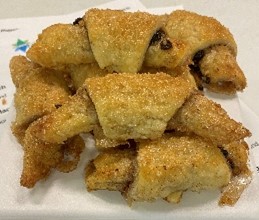 A white plate topped with lots of pastries.